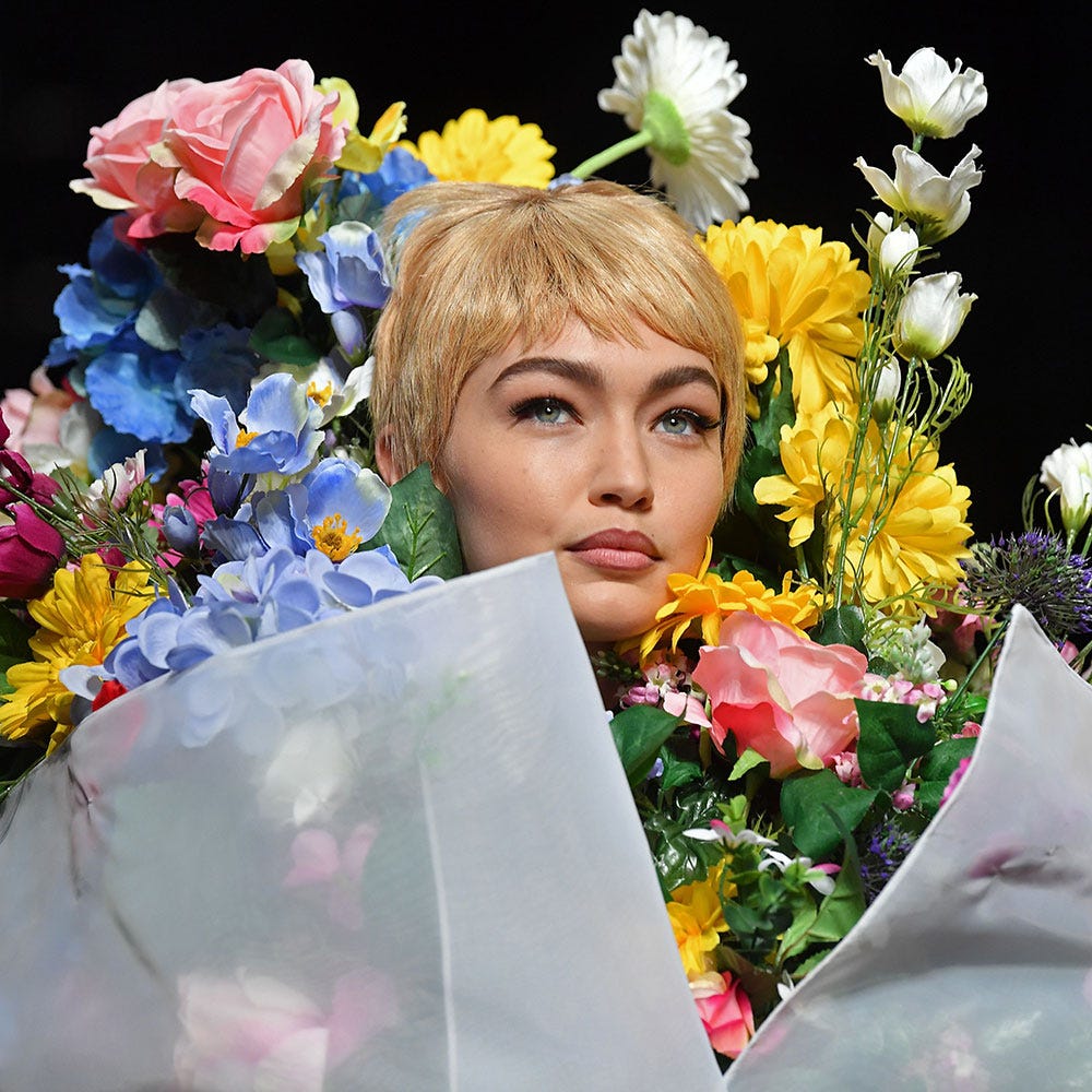 Gigi Hadid Wore a Flower Bouquet at the Moschino Runway Show