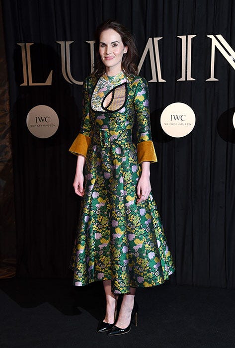 Clothing, Dress, Red carpet, Carpet, Fashion, Fashion model, Hairstyle, Flooring, Formal wear, Fashion design, 