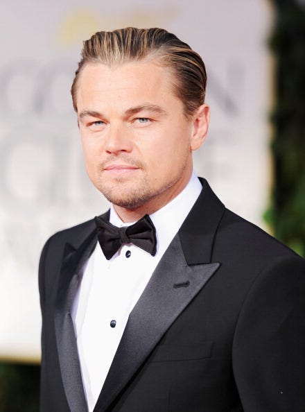 Suit, Hair, Formal wear, Tuxedo, Forehead, Hairstyle, Chin, Eyebrow, White-collar worker, Facial hair, 