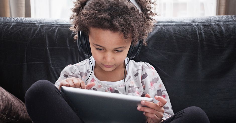 Hair, Hairstyle, Child, Sitting, Electronic device, Technology, Tablet computer, Reading, Gadget, Couch, 
