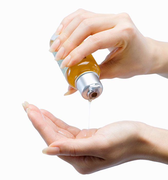 Finger, Amber, Liquid, Thumb, Nail, Medical, Chemical substance, Hypodermic needle, Bottle, Laboratory equipment, 
