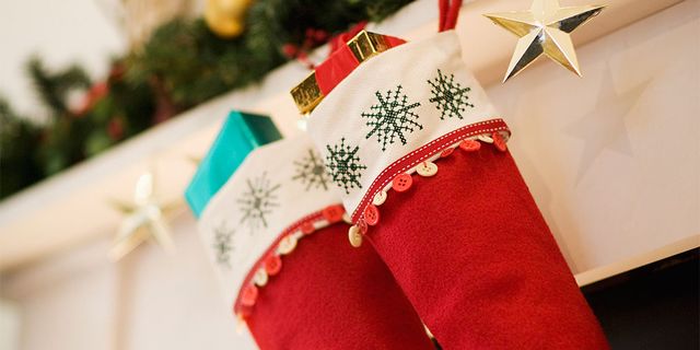 Christmas decoration, Christmas stocking, Carmine, Christmas, Costume accessory, Holiday, Christmas eve, Interior design, Sock, Ribbon, 