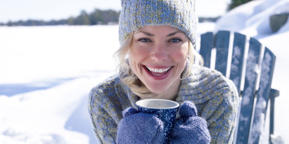 Facial expression, Knit cap, Smile, Winter, Beanie, Bonnet, Headgear, Fun, Coffee cup, Freezing, 