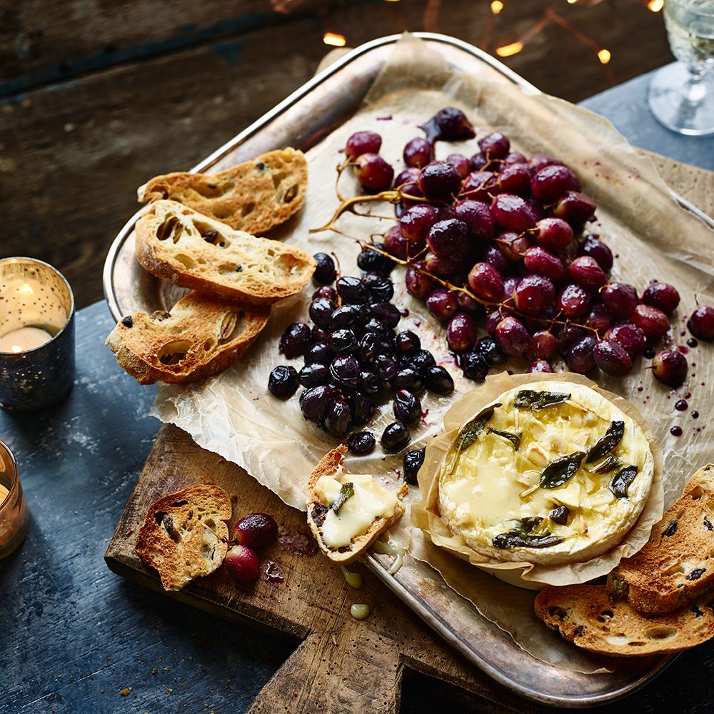 baked tunworth with roasted grapes and crostini