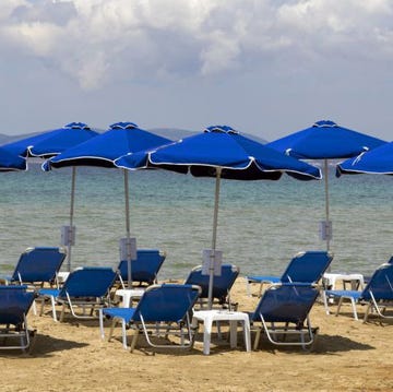 Umbrella, Sunlounger, Shade, Sky, Outdoor furniture, Beach, Resort, Furniture, Canopy, Folding chair, 