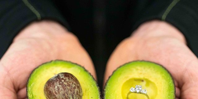 Avocado, Fruit, Food, Plant, Natural foods, Superfood, Hand, Footwear, Produce, Accessory fruit, 