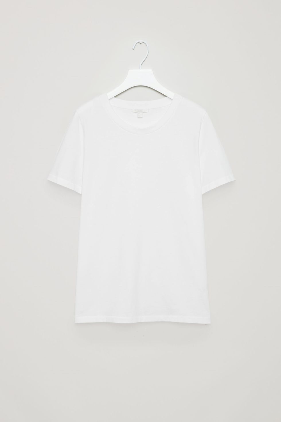 White, Clothing, T-shirt, Sleeve, Top, Collar, Clothes hanger, Outerwear, Neck, Shirt, 