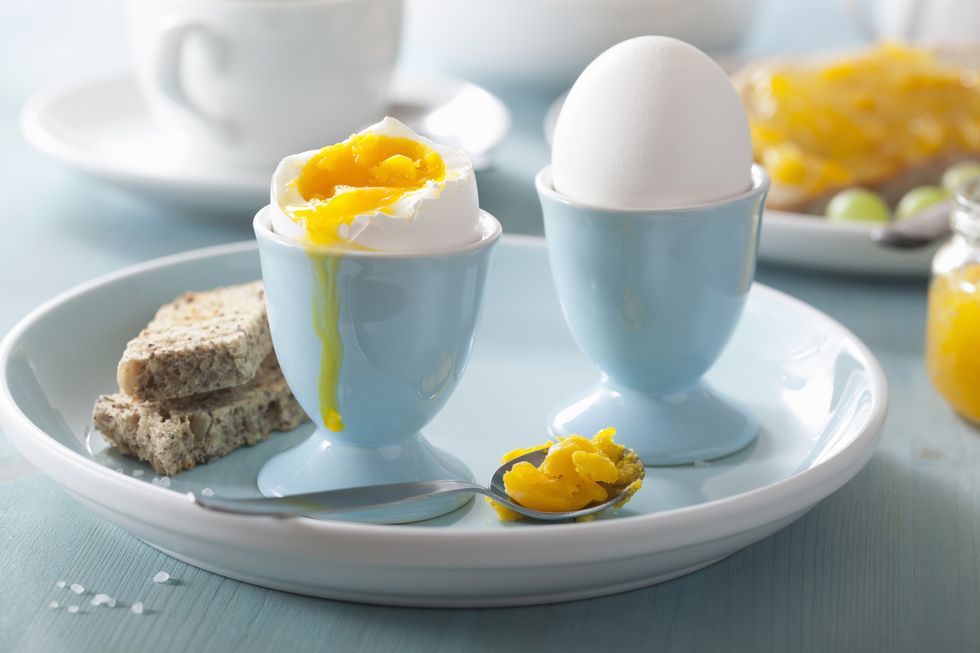 Food, Boiled egg, Egg, Egg cup, Dish, Ingredient, Serveware, Cuisine, Yellow, Breakfast, 