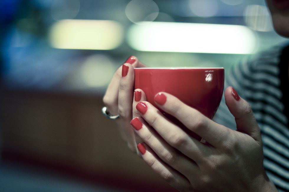 Red, Hand, Nail, Finger, Cup, Cup, Material property, Photography, Electronic device, Gesture, 
