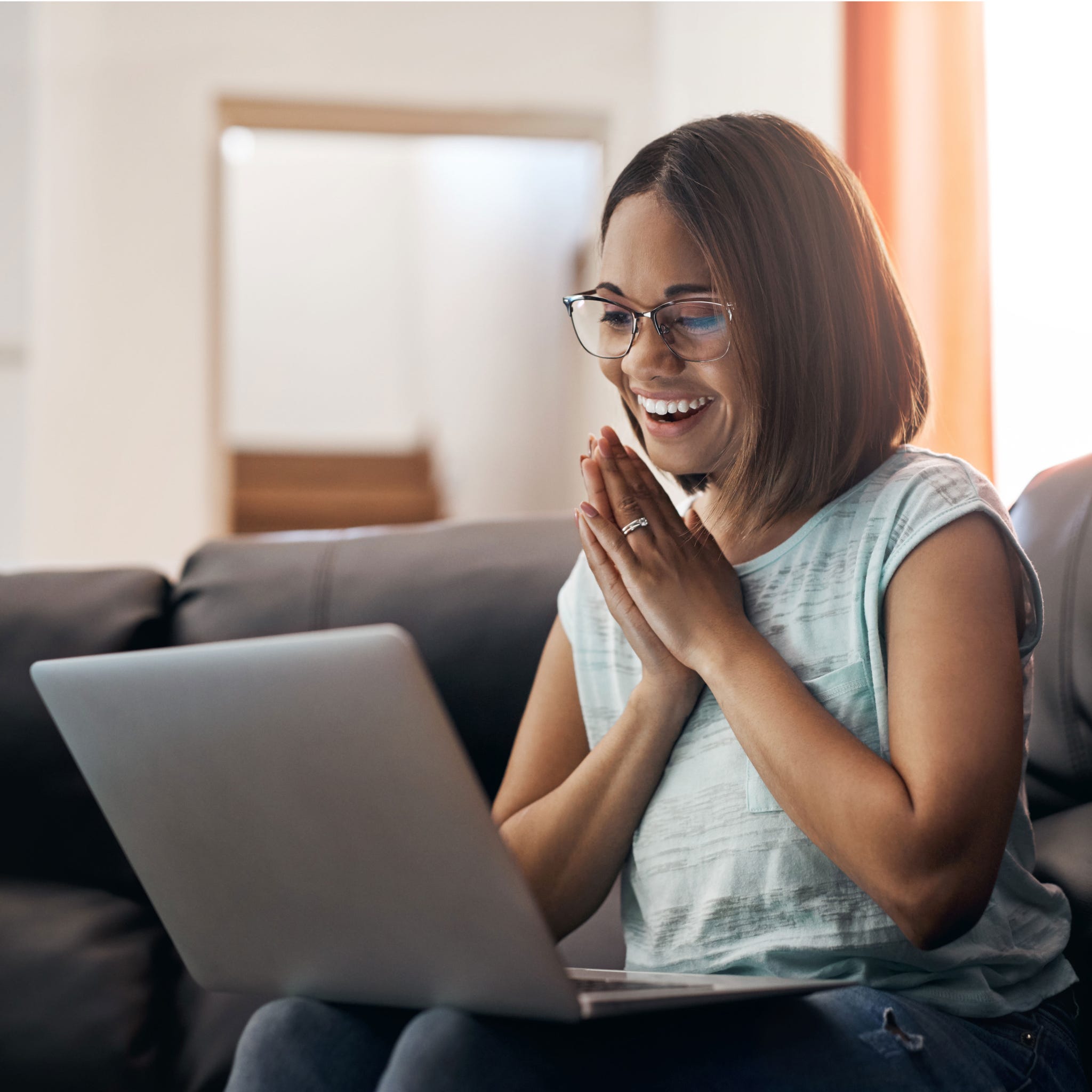 Facial expression, Sitting, Glasses, Smile, Room, Technology, Fun, Electronic device, Photography, Comfort, 