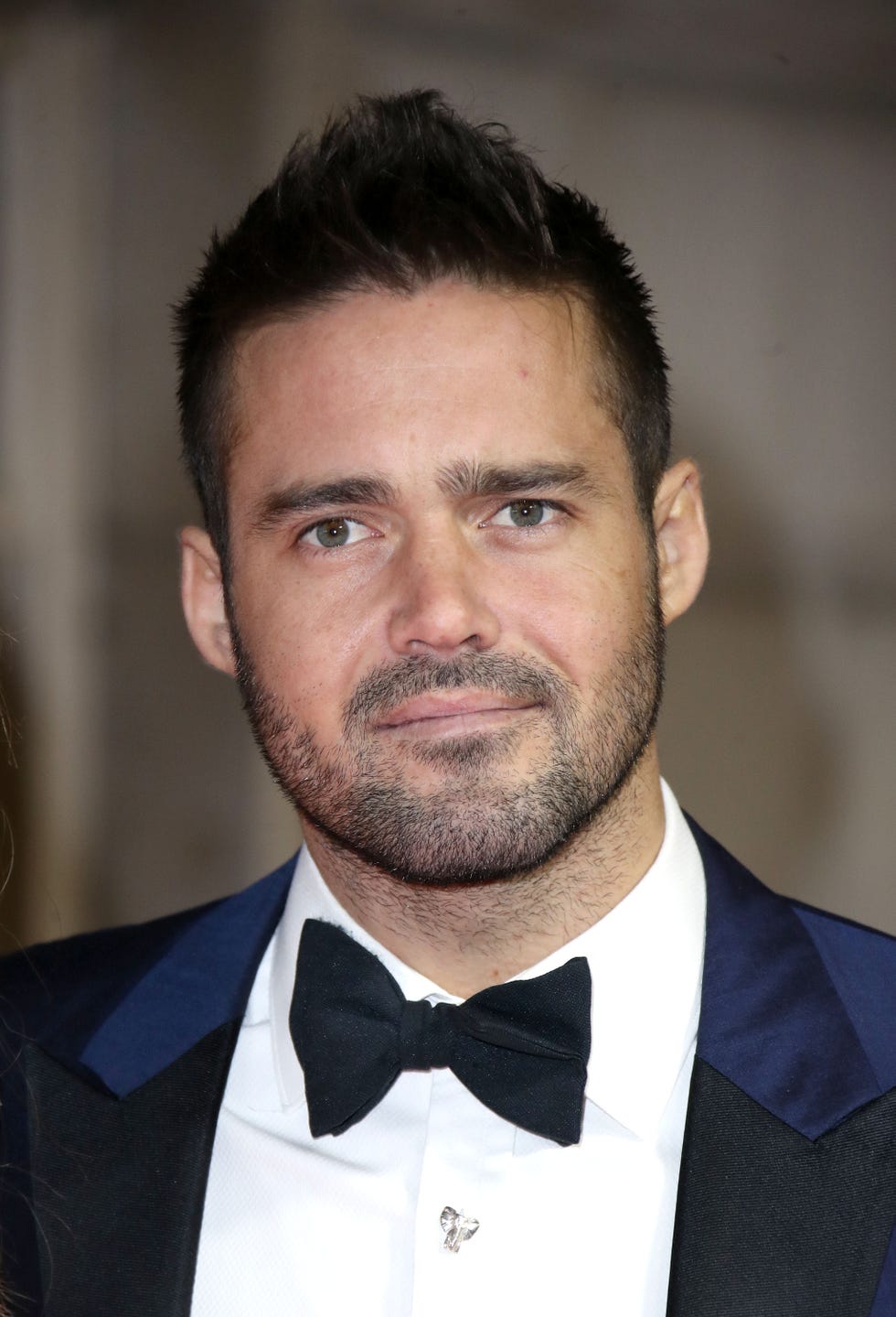 Hair, Facial hair, Face, Tie, Beard, Bow tie, Forehead, Eyebrow, Chin, Suit, 