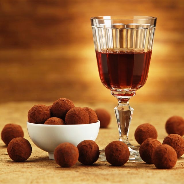 Food, Liqueur, Chocolate truffle, Still life photography, Drink, Distilled beverage, Nut, Ingredient, Glass, Drinkware, 