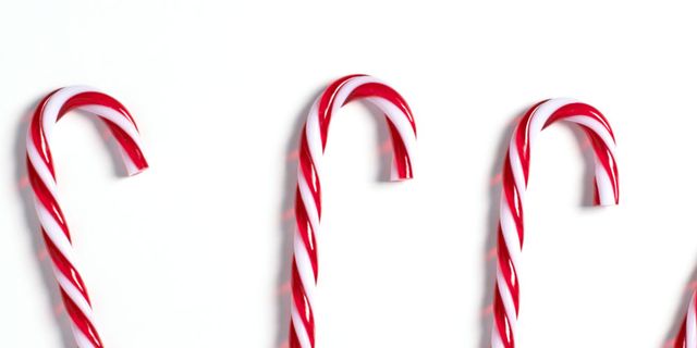 Stick candy, Christmas, Polkagris, Candy, Confectionery, Candy cane, Holiday, Event, Font, Hard candy, 