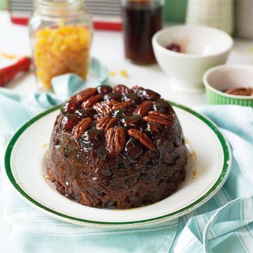 Pecan and cherry-topped Christmas Pudding