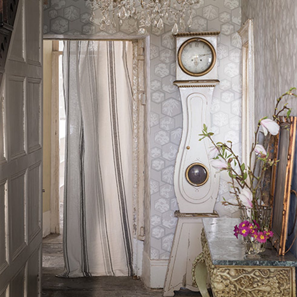 Room, Interior design, Floor, Fixture, Wall clock, Interior design, Window treatment, Curtain, Clock, Flower Arranging, 