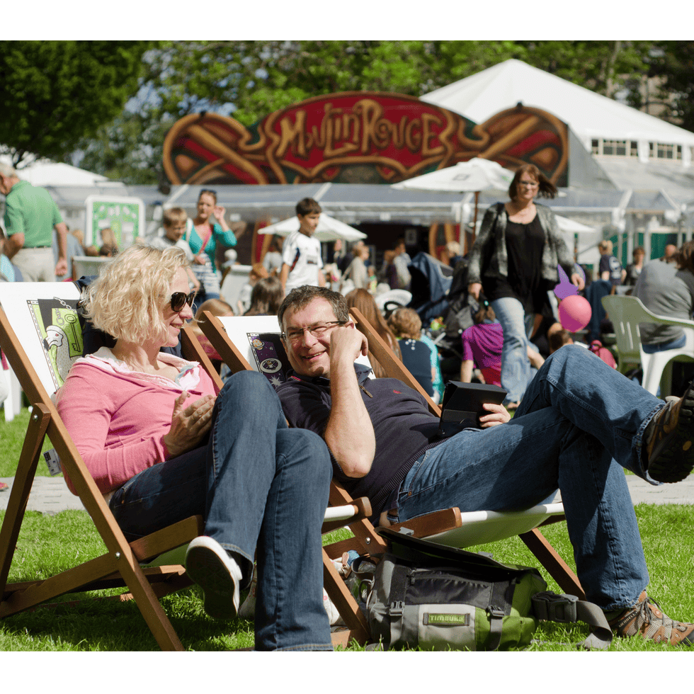Leisure, Sitting, Jeans, Public space, Chair, Folding chair, Outdoor furniture, Spring, Wind instrument, Lap, 