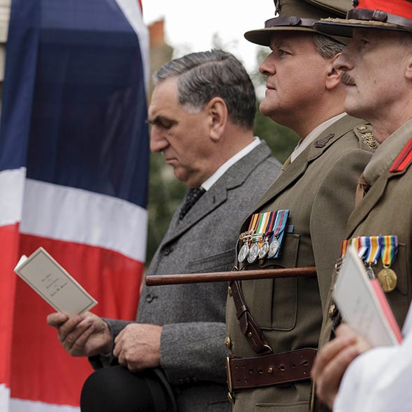 Military uniform, Soldier, Cap, Flag, Microphone, Uniform, Military person, Military organization, Blazer, Military, 
