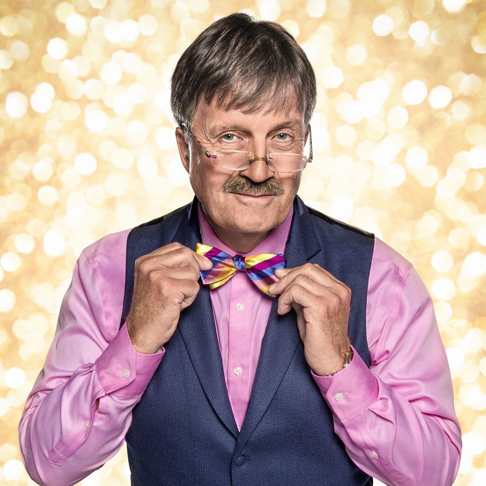 Clothing, Finger, Dress shirt, Collar, Happy, Formal wear, Purple, Facial expression, Magenta, Temple, 