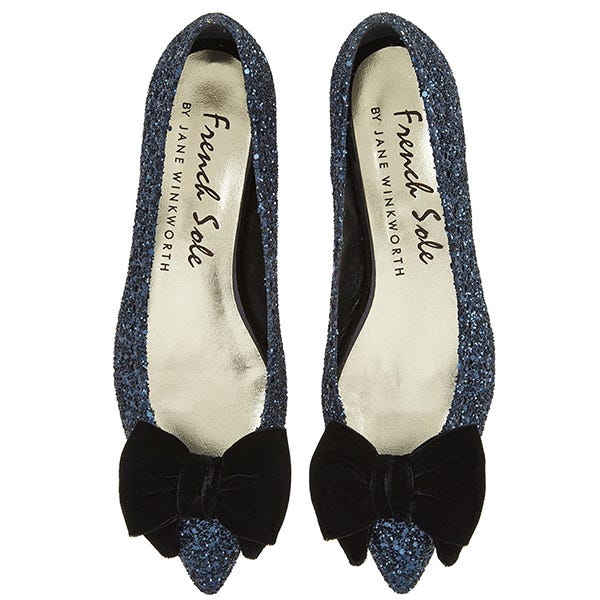 Black, Costume accessory, Ballet flat, Fashion design, Dress shoe, Natural material, Brassiere, Dancing shoe, Synthetic rubber, 