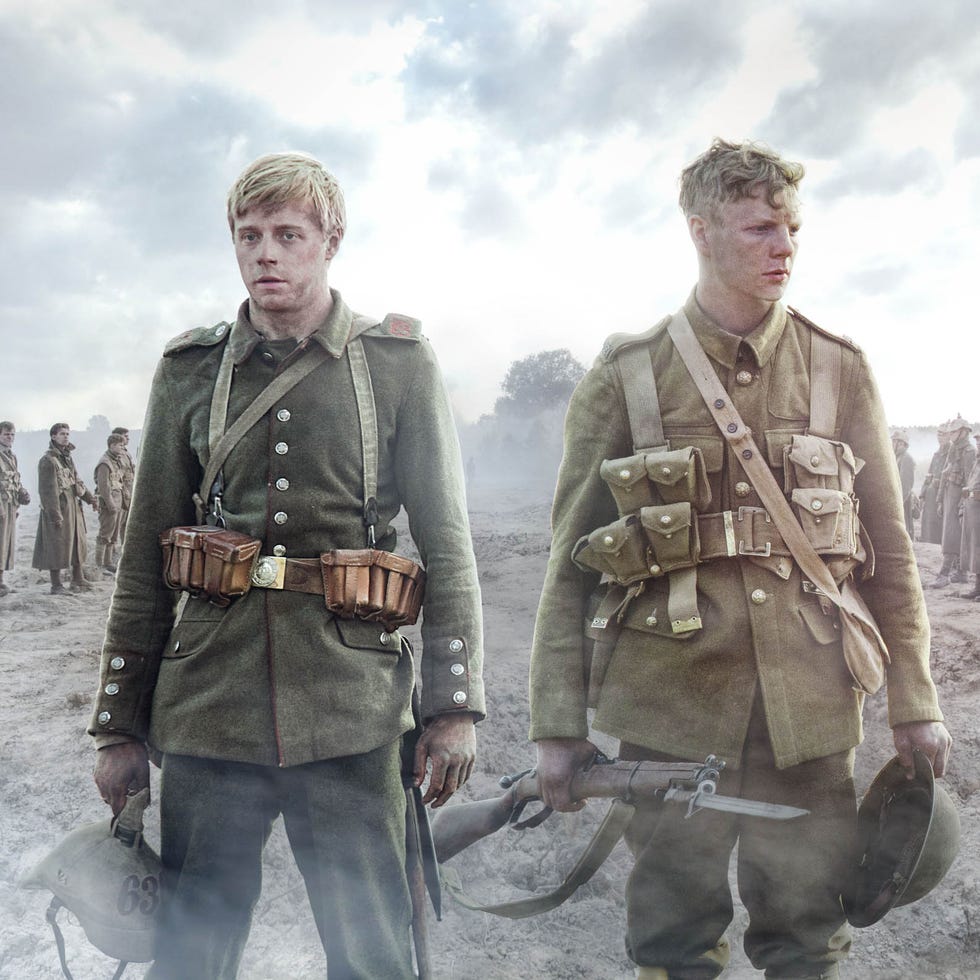 Standing, Collar, Uniform, Military uniform, Soldier, Belt, Shotgun, Air gun, Vintage clothing, Military organization, 