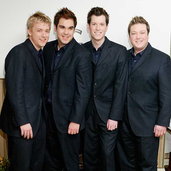 Smile, Dress shirt, Collar, Sleeve, Trousers, Coat, Shirt, Social group, Standing, Suit trousers, 