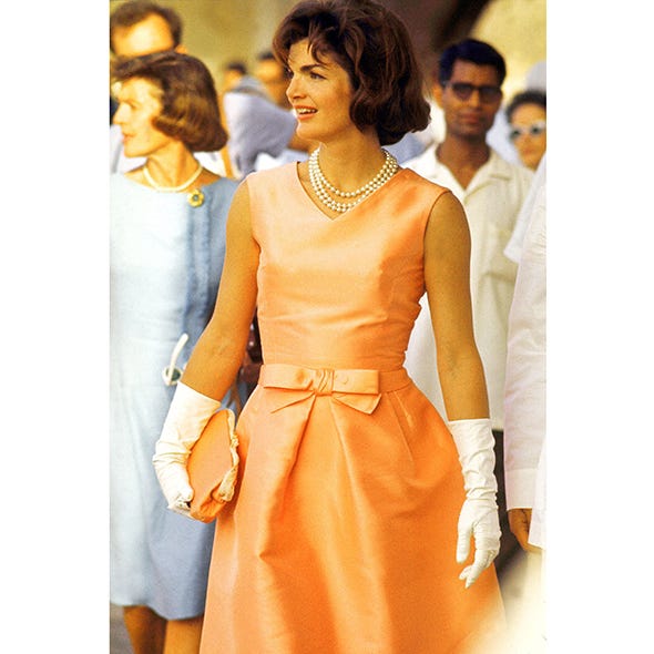 Sleeve, Dress, Jewellery, Formal wear, One-piece garment, Amber, Orange, Fashion, Necklace, Day dress, 