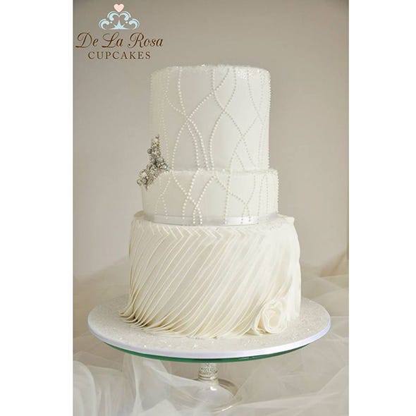Cuisine, Dessert, Cake, Baked goods, Cake decorating, Costume accessory, Wedding ceremony supply, Ingredient, Ivory, Serveware, 