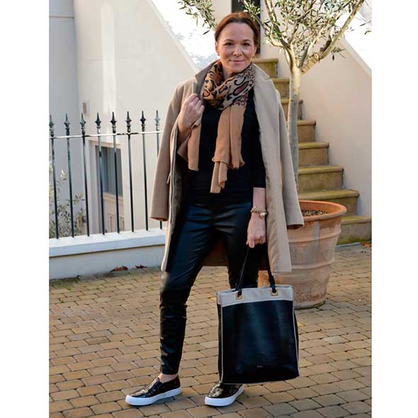 Standing, Jeans, Scarf, Street fashion, Bag, Stole, Travel, Denim, Beige, Wrap, 