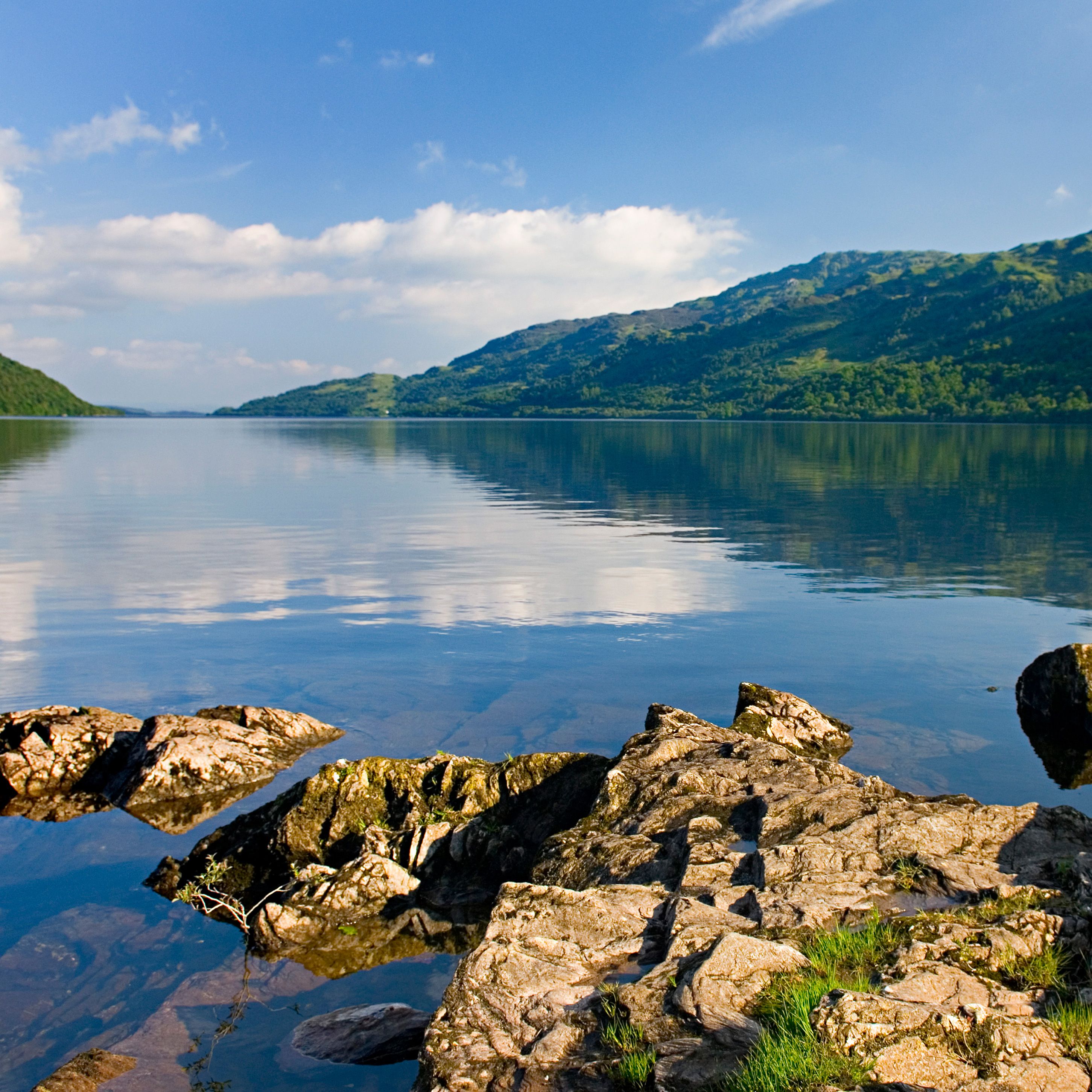 Body of water, Natural landscape, Water resources, Water, Highland, Bank, Reflection, Watercourse, Hill, Mountain range, 
