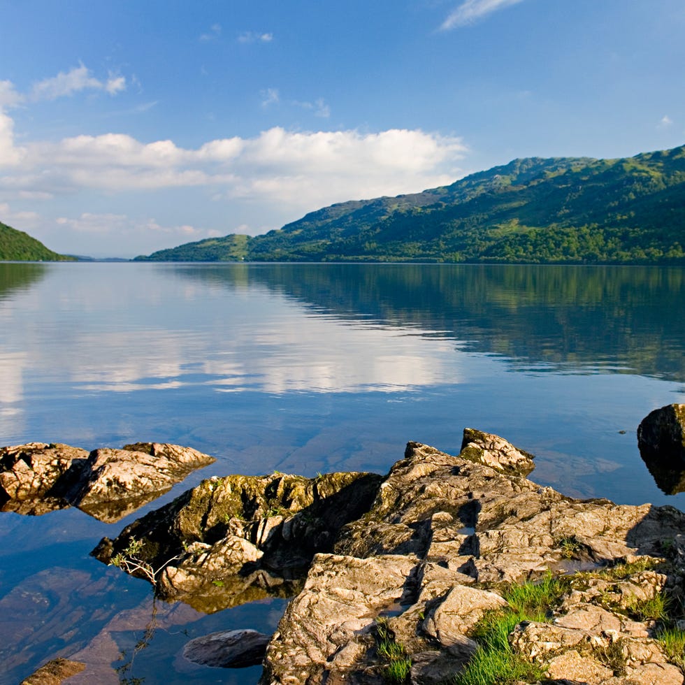 Body of water, Natural landscape, Water resources, Water, Highland, Bank, Reflection, Watercourse, Hill, Mountain range, 
