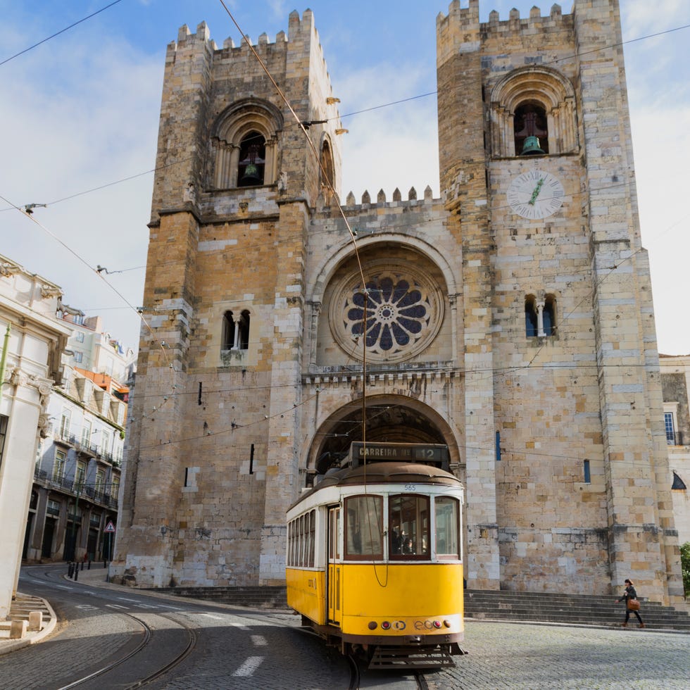 Architecture, Building, Landmark, Track, Rolling stock, Arch, Train, Medieval architecture, Electricity, Rolling, 