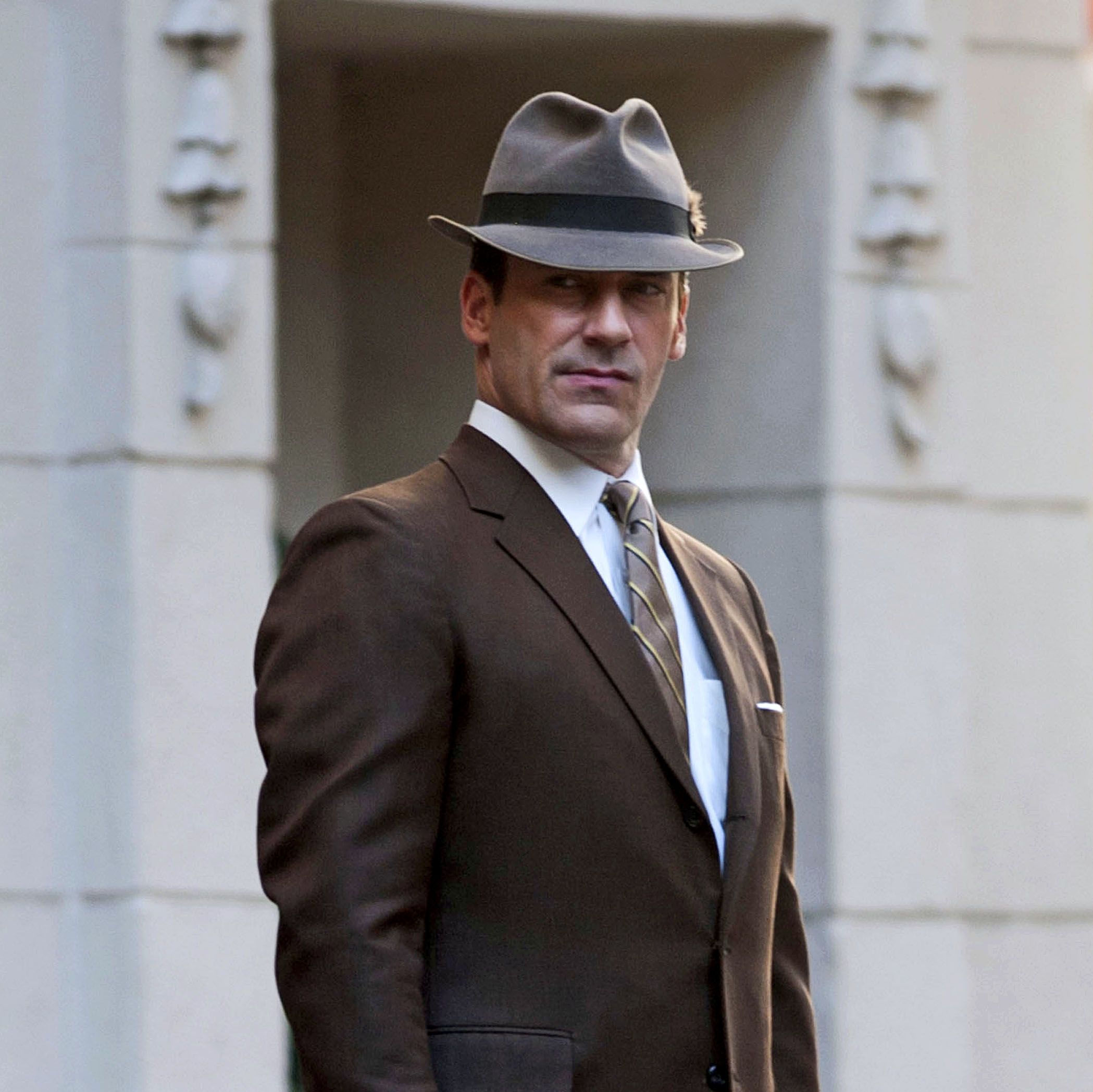 Clothing, Coat, Hat, Dress shirt, Collar, Sleeve, Shirt, Suit, Standing, Outerwear, 