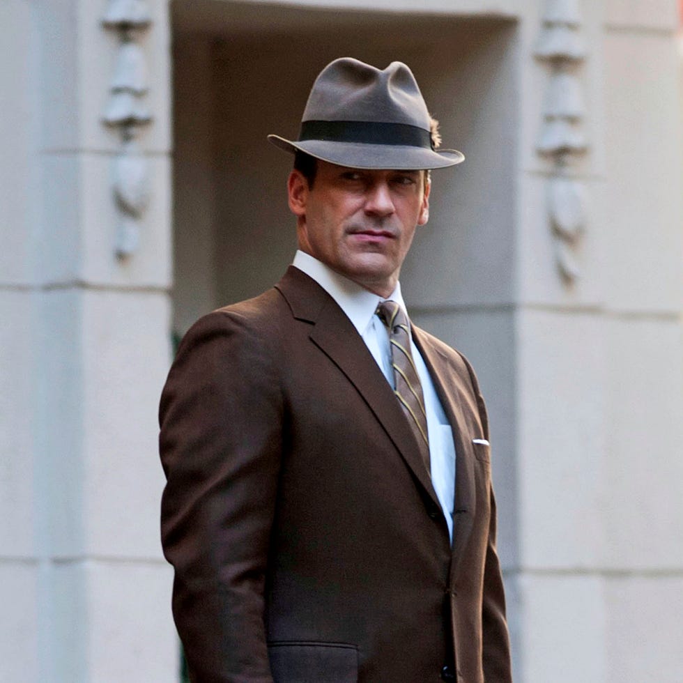 Clothing, Coat, Hat, Dress shirt, Collar, Sleeve, Shirt, Suit, Standing, Outerwear, 