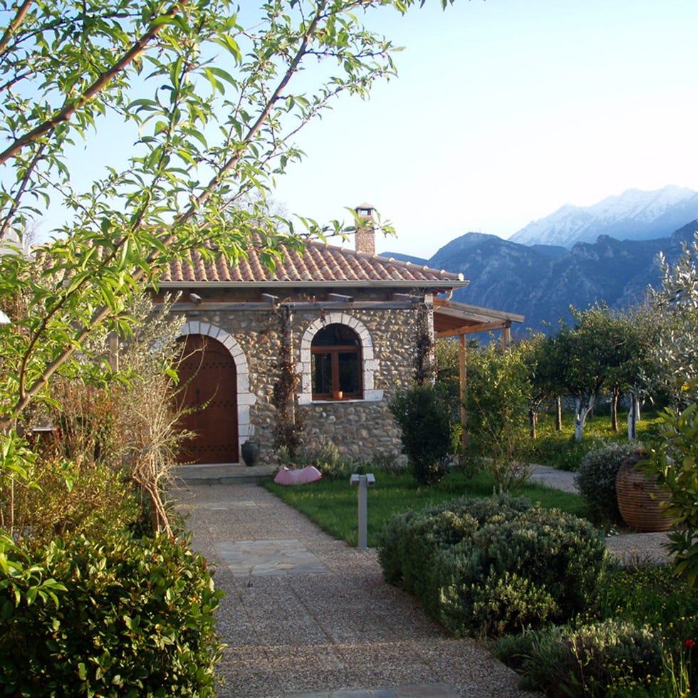 Plant, Shrub, Garden, House, Mountain range, Arch, Rural area, Door, Walkway, Hill station, 
