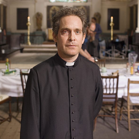 Collar, Tablecloth, Beard, Restaurant, Clergy, Facial hair, Houseplant, Sweater, Priesthood, Outdoor furniture, 