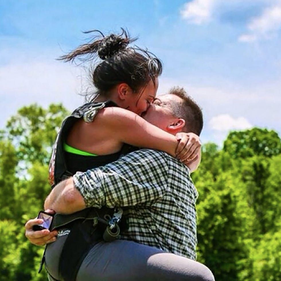 Ear, Mammal, People in nature, Summer, Interaction, Love, Bag, Sleeveless shirt, Romance, Luggage and bags, 