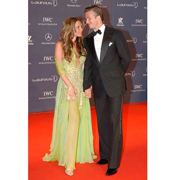 Clothing, Coat, Trousers, Event, Suit, Flooring, Dress, Outerwear, Formal wear, Carpet, 