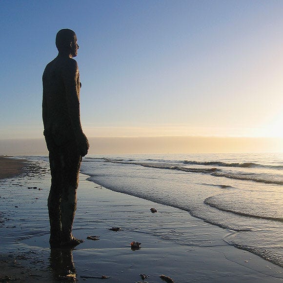 Fluid, Coastal and oceanic landforms, Standing, Horizon, Shore, People in nature, Sunlight, Beach, Ocean, Wetland, 