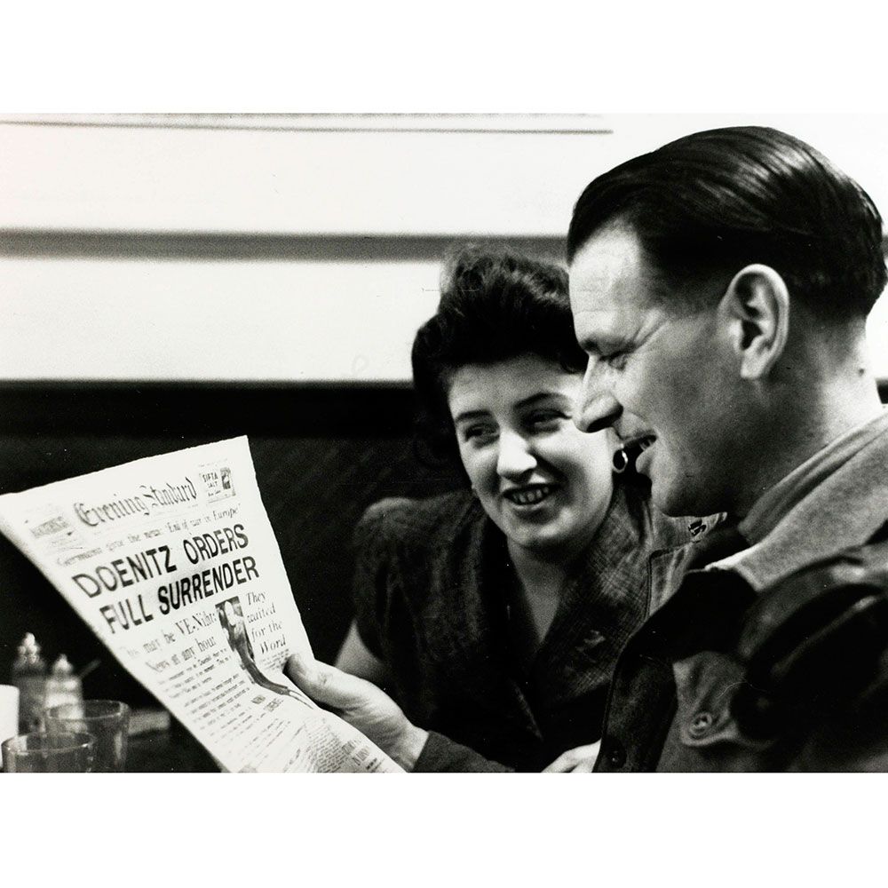 Happy, Facial expression, Reading, Publication, Love, Cup, Paper, News, Laugh, Paper product, 
