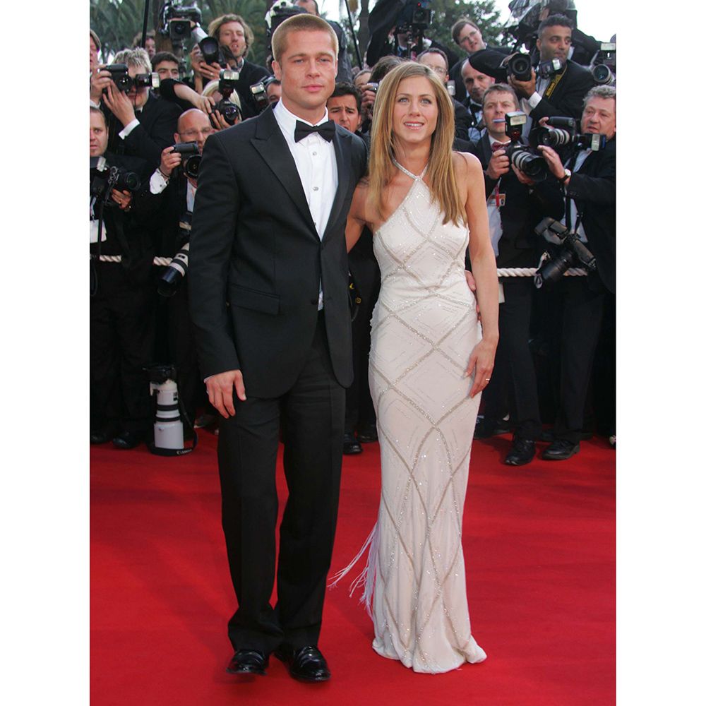 Clothing, Coat, Event, Trousers, Hat, Dress, Flooring, Suit, Shirt, Outerwear, 