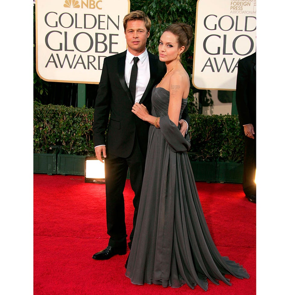 Clothing, Coat, Trousers, Dress, Flooring, Suit, Outerwear, Formal wear, Carpet, Style, 