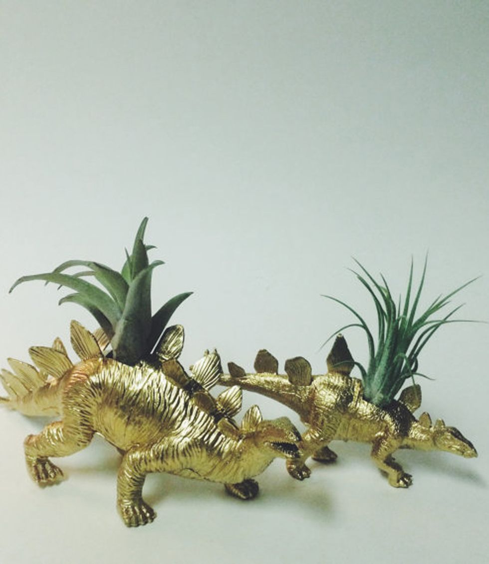 Jaw, Dinosaur, Toy, Terrestrial plant, Figurine, Sculpture, Claw, Tail, Animal figure, 