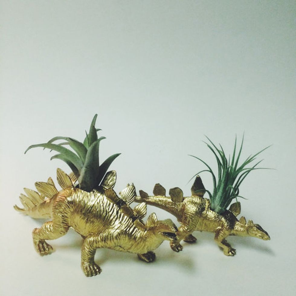 Jaw, Dinosaur, Toy, Terrestrial plant, Figurine, Sculpture, Claw, Tail, Animal figure, 