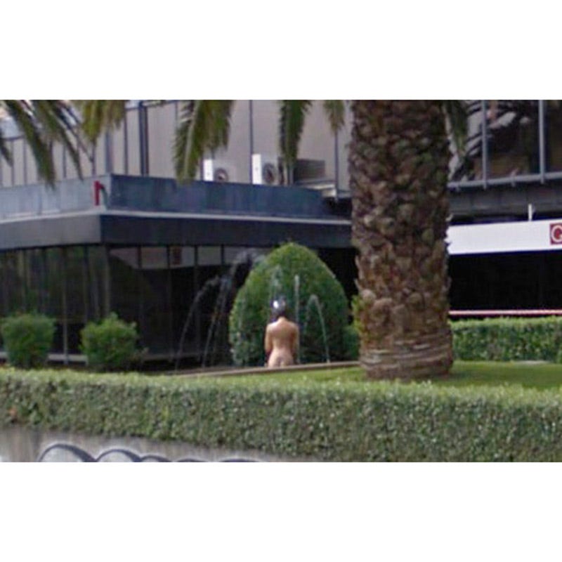 Shrub, Urban design, Sidewalk, Lawn, Arecales, Palm tree, Walkway, Figurine, Landscaping, Overpass, 