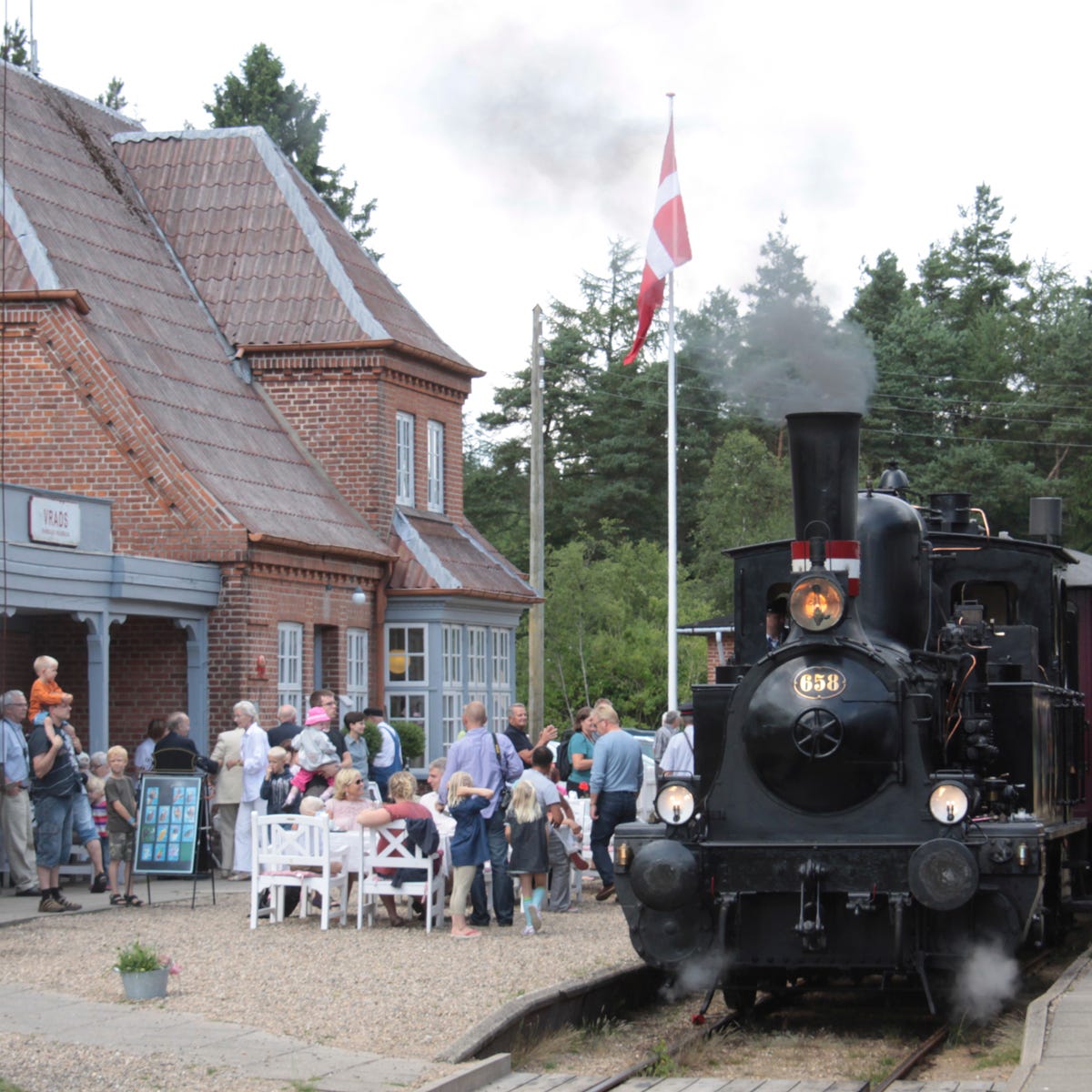 Steam engine, Locomotive, Rolling stock, Flag, Railway, Train, Chair, Iron, Pole, Outdoor furniture, 
