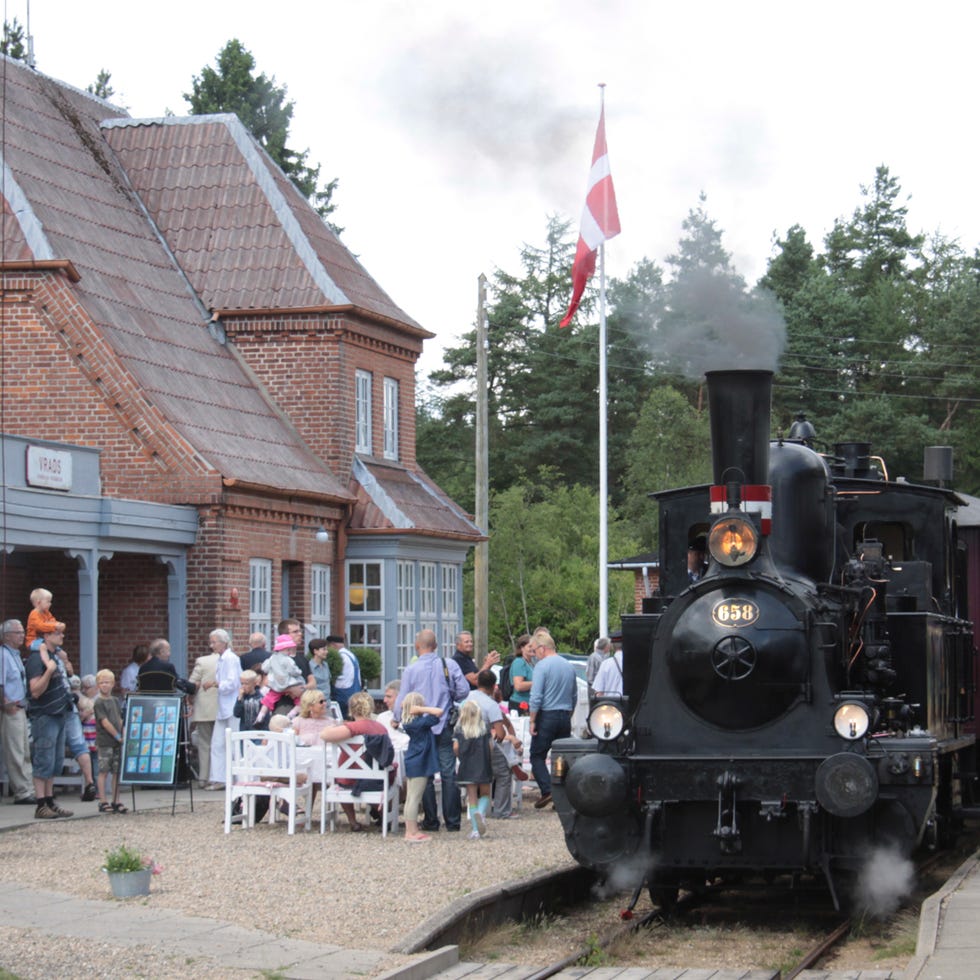 Steam engine, Locomotive, Rolling stock, Flag, Railway, Train, Chair, Iron, Pole, Outdoor furniture, 