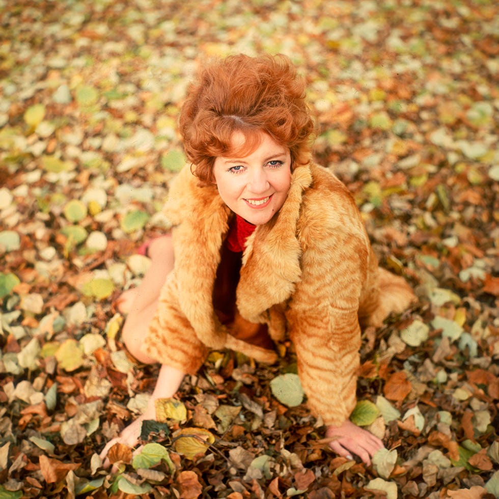 Clothing, Human, Lip, Textile, Happy, People in nature, Toy, Autumn, Deciduous, Fur clothing, 