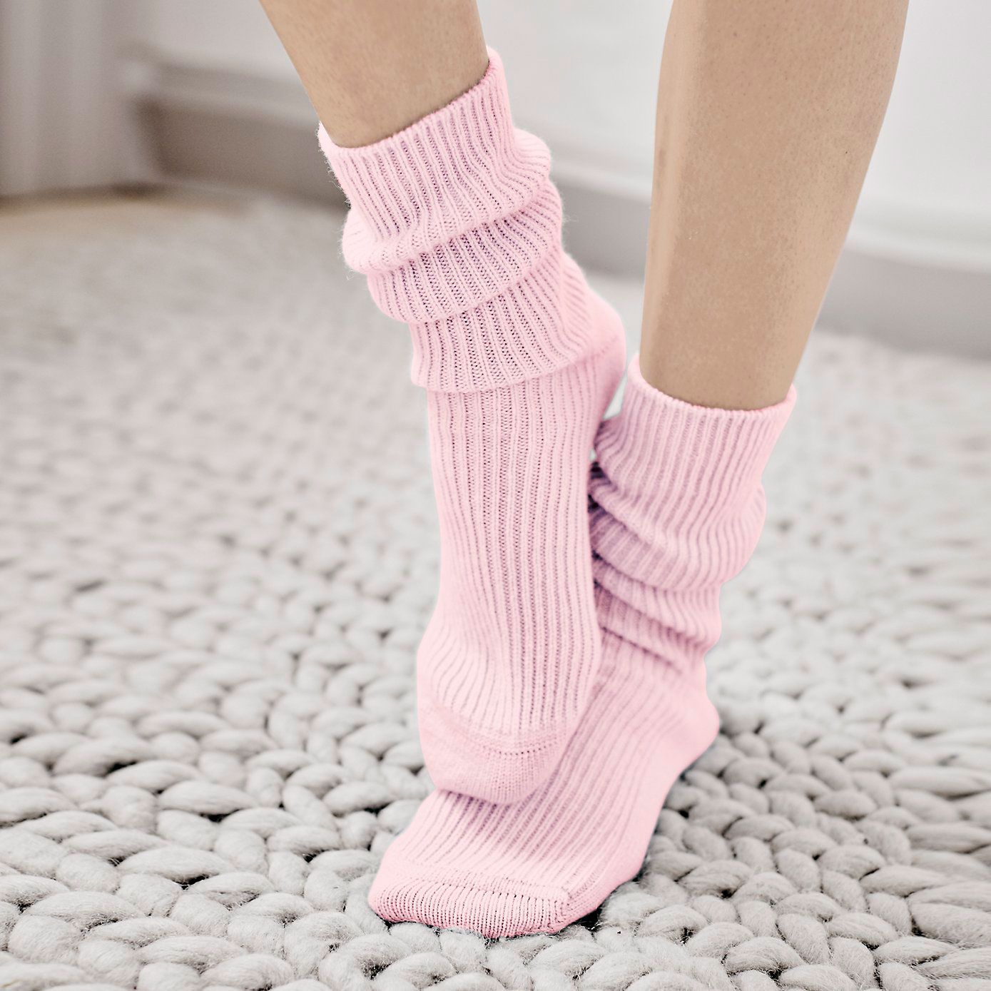 Human leg, Joint, Pink, Floor, Flooring, Sock, Beige, Foot, Ankle, Woolen, 