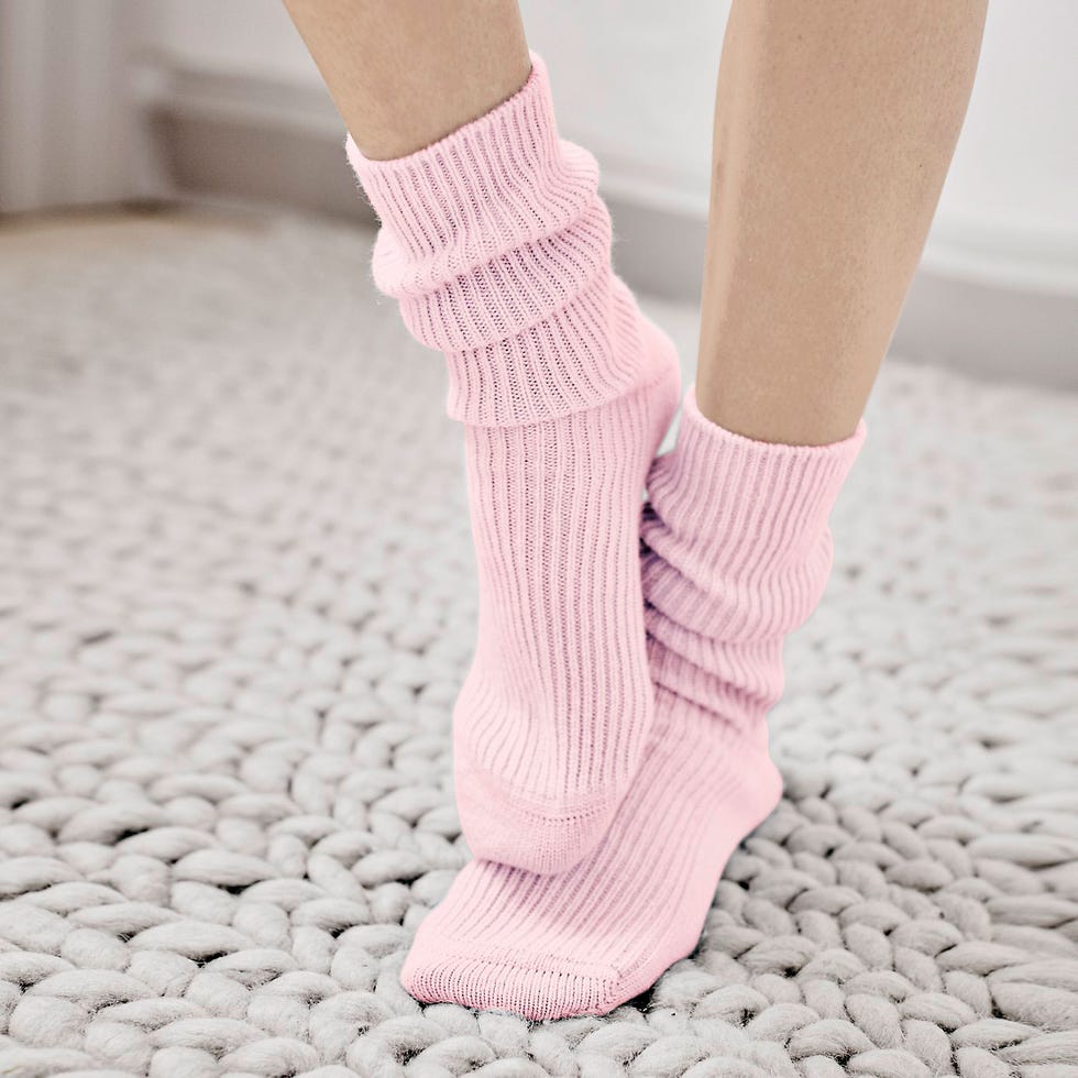 Human leg, Joint, Pink, Floor, Flooring, Sock, Beige, Foot, Ankle, Woolen, 