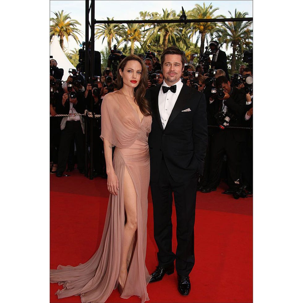 Clothing, Coat, Event, Trousers, Flooring, Shirt, Suit, Outerwear, Dress, Carpet, 